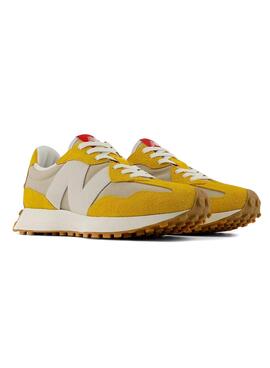 Zapatillas New Balance 327 amarillas para hombre.